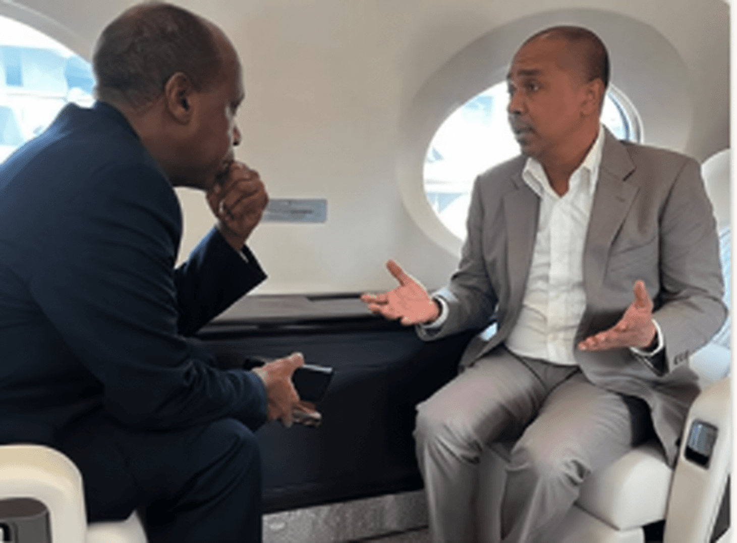 Private aviation consultation inside a jet cabin